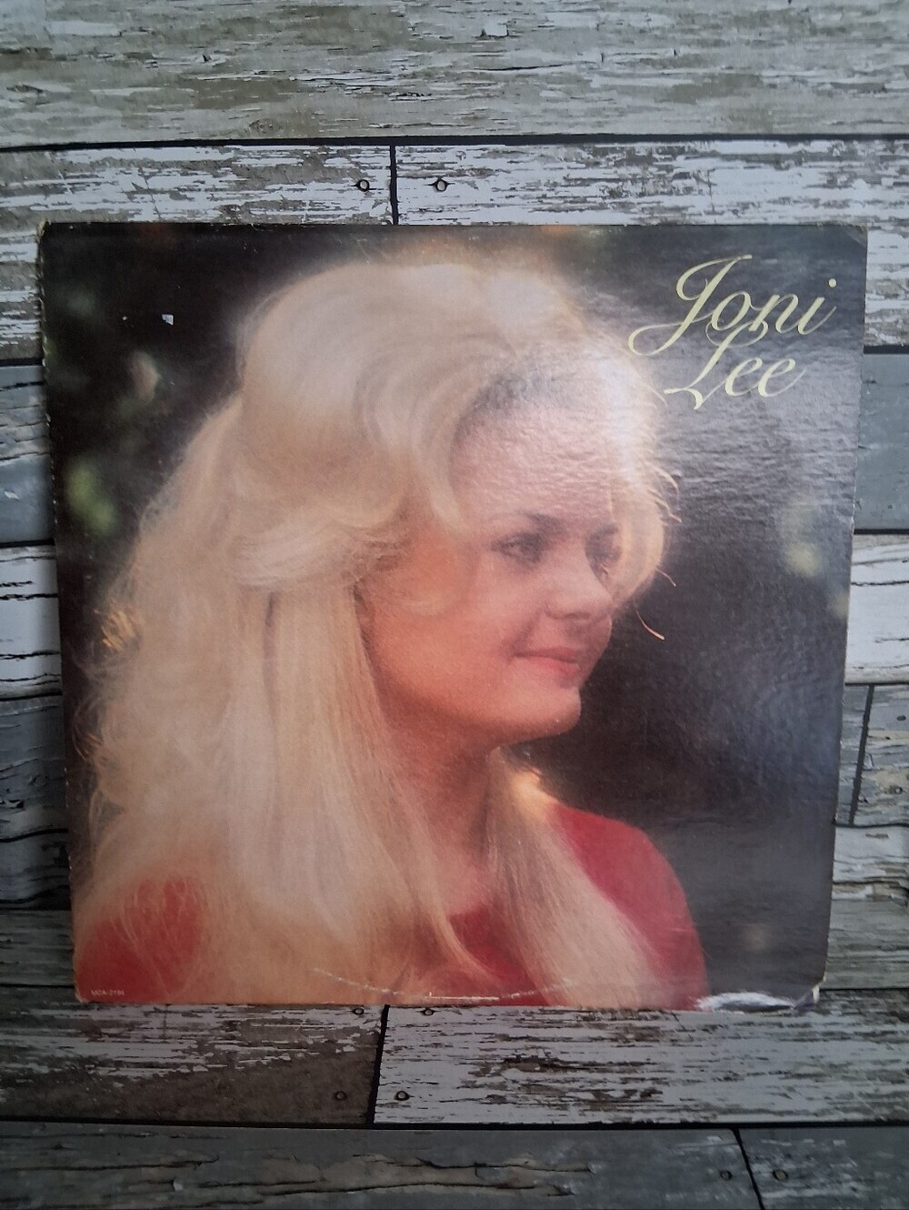 Joni Lee Album Cover - Blonde Portrait on Red